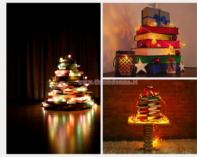 libri impilati a formare albero di Natale ghirlanda stringa luci led stelle lanterna decorazioni natalizie