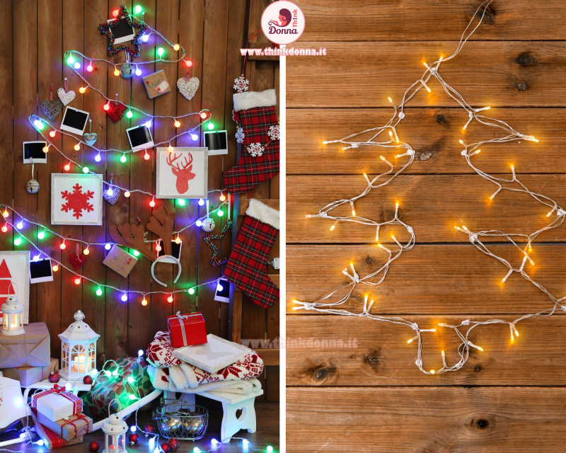 stringa di luce forma albero di natale con appese foto cuori lanterne candele plaid natalizio nordico parete assi di legno