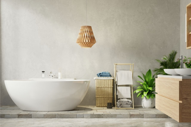 vasca da bagno stile moderno cesta vimini vaso ceramica pianta foglie verdi