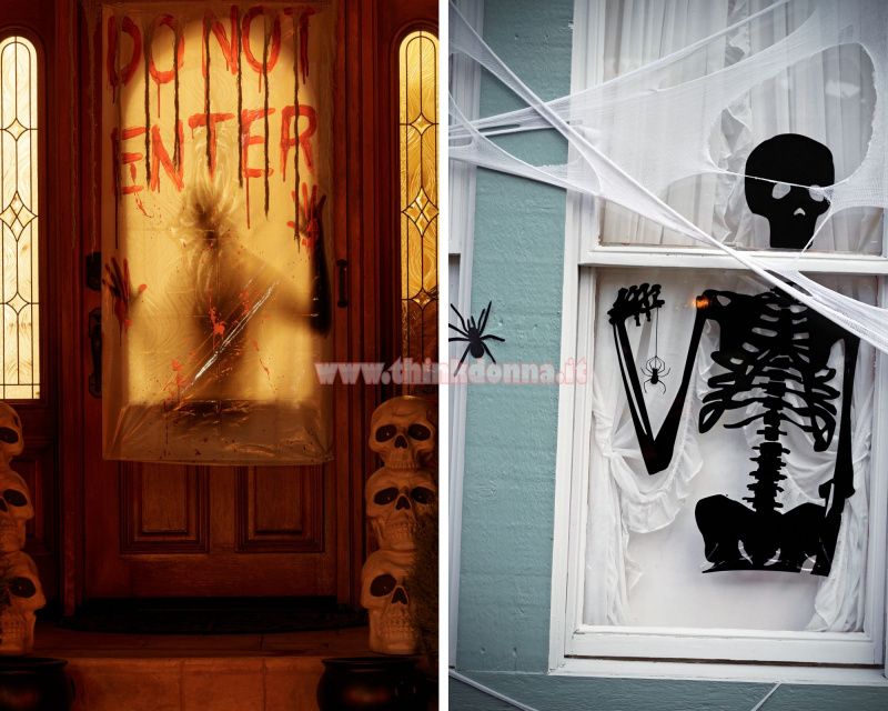 porta di casa decorata tema Halloween teschio scritta do not enter scale scheletro nero su porta bianca ragnatela