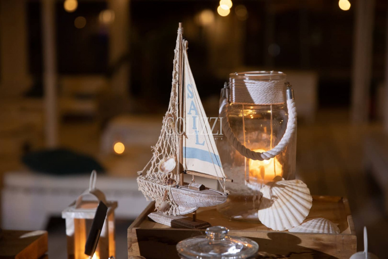 tema delle nozze mare miniatura barca a vela rete conchiglie corda lanterna 