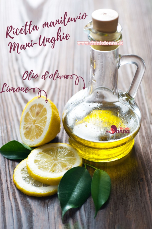 bottiglia vetro tappo sughero olio oliva fette foglie limone tavolo legno